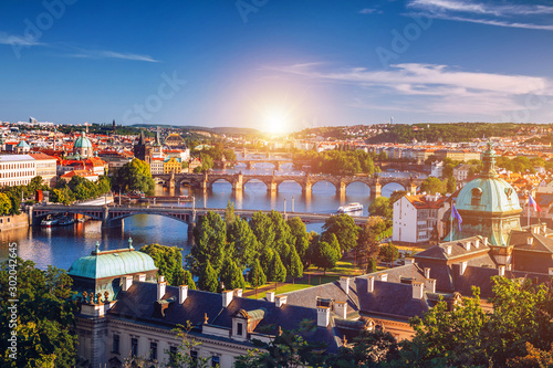 Charles Bridge (Karluv Most) and Lesser Town Tower, Prague in summer at sunset, Czech Republic photo