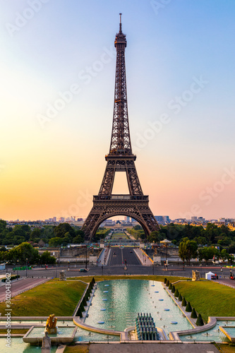 Eiffel tower in summer, Paris, France. Scenic panorama of the Eiffel tower under the blue sky. View of the Eiffel Tower in Paris, France in a beautiful summer day. Paris, France.