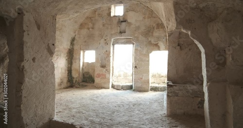 Sassi of Matera with arched ceilings and vaults. Doors and windows in an ancient underground house dug out of the tufa rock.