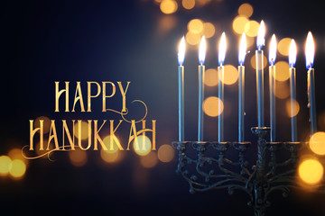 Religion image of jewish holiday Hanukkah background with menorah (traditional candelabra) and candles