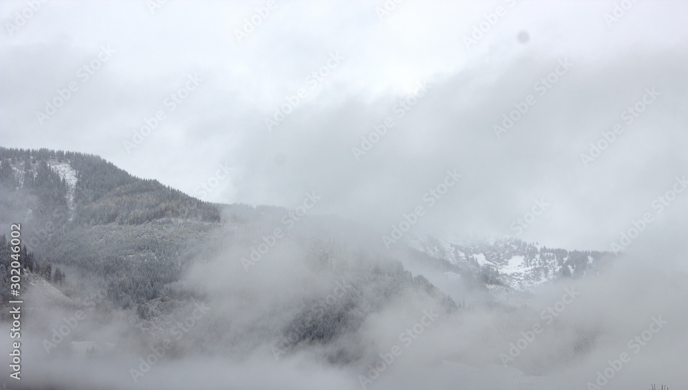 Winter in Upper Austria, view of the Alps through a cloud cover Winter in Upper Austria, view of the Alps through a cloud cover