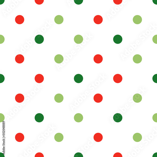 Small red and green on white vector polka dot seamless pattern for Christmas and holiday package design