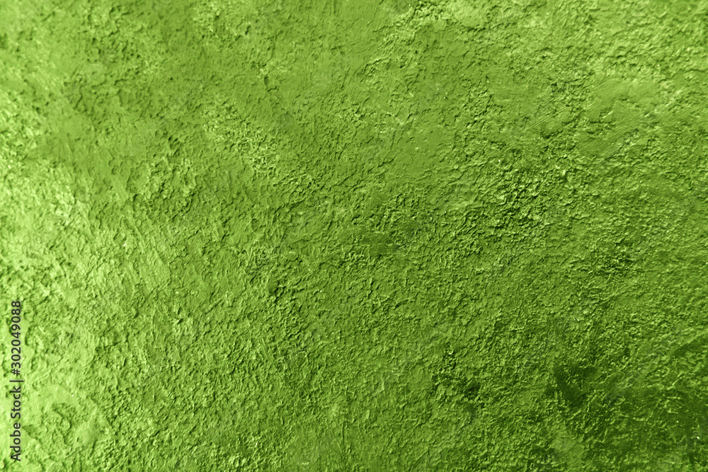 Background texture of a textured wall in green. Stylized textural banner with space for text.