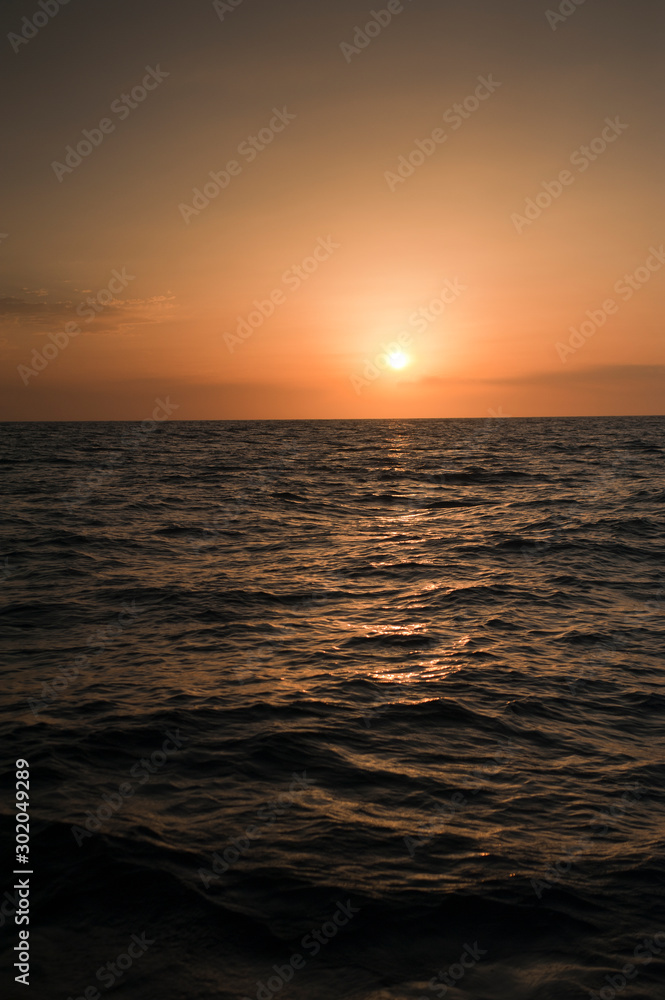 wonderful sunset in the middle of the sea