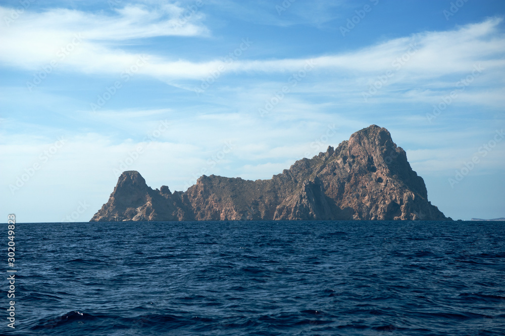 island of es vedra imposing rock massif seen from the sea