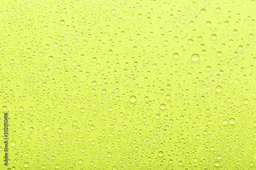 Water drops on green background