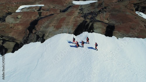 scientists in antarctica go and ride snowmobiles