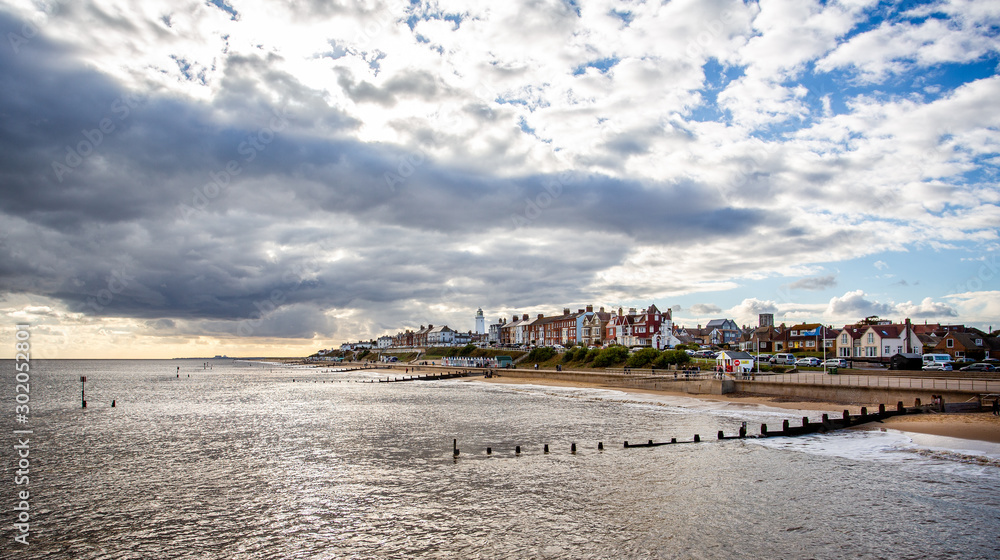 Southwold seafront and lighthouse with dramtaic sky in Southwold, Suffolk, UK