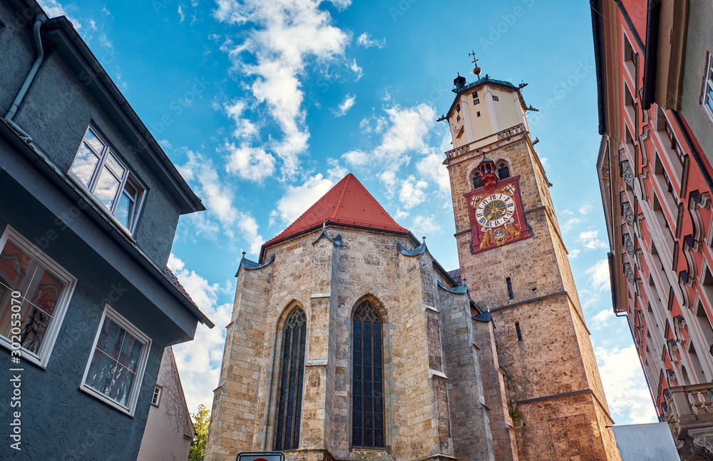 St. Martin church with the clock in the old city in Memmingen.