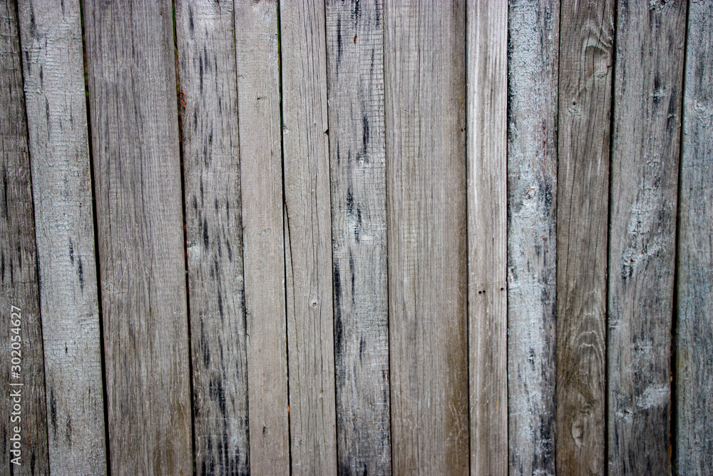 Old wooden boards with peeling paint. Old background. Textured planks of oak and pine. Bright colours. Natural aging of the material. Old wooden boards with peeling paint. Old background. Textured planks of oak and pine. Bright colours. Natural aging of the material.
