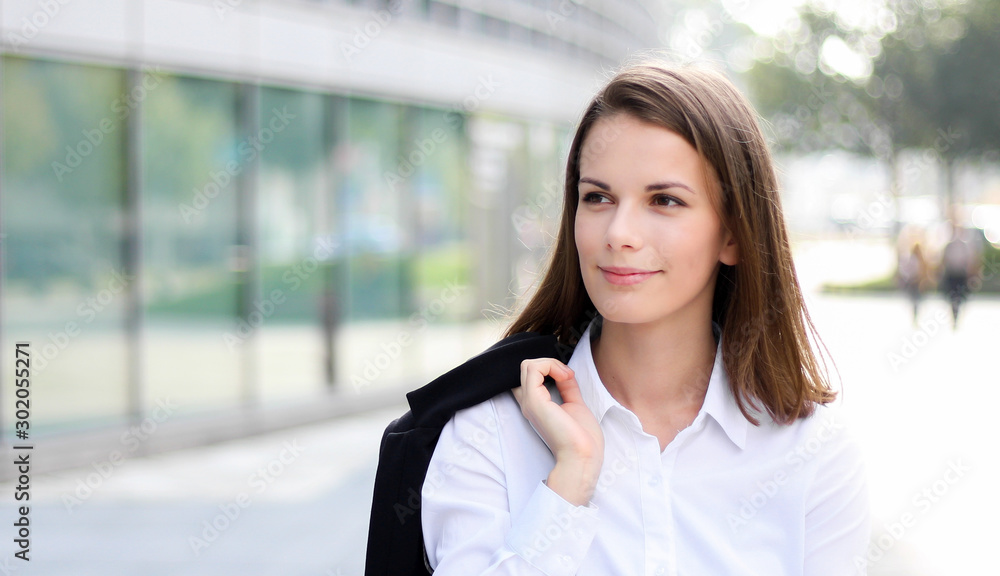 Confident young female manager outdoor in a modern urban setting Confident young female manager outdoor in a modern urban setting