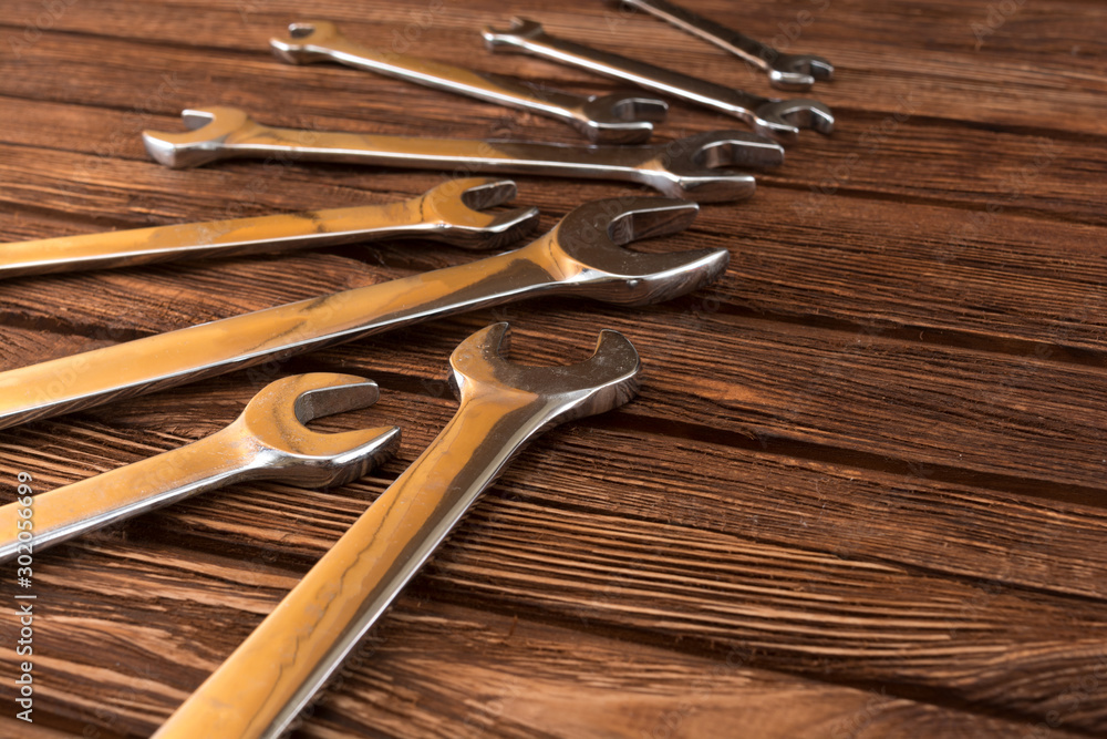Work tool of the wizard. Wrenches on a wooden surface. Free space for text. Work tool of the wizard. Wrenches on a wooden surface. Free space for text.