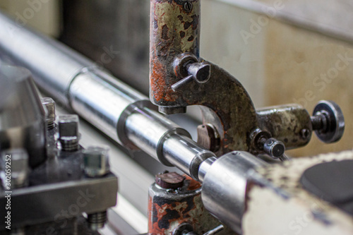 Processing of a steel shaft in a lunette fixture.