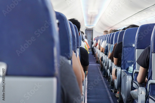 View of passengers on seats inside Aeroplane