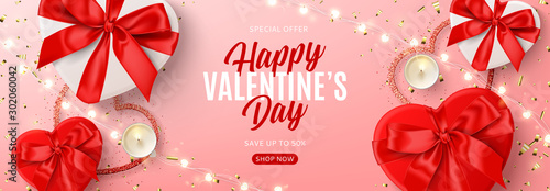 Valentine's Day sale banner template. Vector illustration with realistic red and white gift boxes, sparkling light garland, candles and confetti on pink background. Promo discount banner.