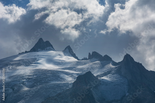 Wallpaper Mural Wonderful views of the mountains in the Swiss Alps with backpackers.	 Torontodigital.ca