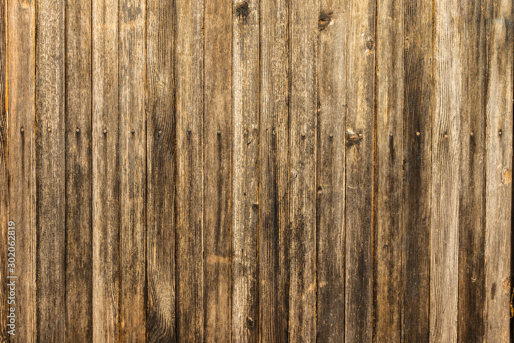 Naklejka premium Old gloomy planks nailed with rusty nails