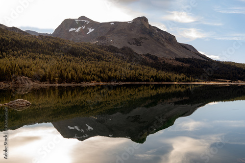 Reflections in smooth water at Dog Laek in Yosemite National Park photo