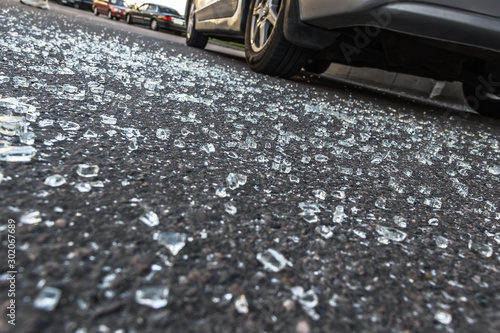 Wallpaper Mural Broken rear glass of car, spread fragments of glass on asphalt Torontodigital.ca
