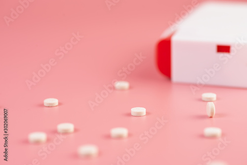 sweetener tablets on pink background