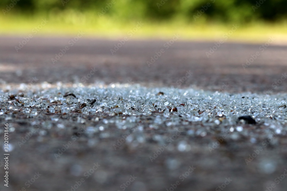 Broken glass on the asphalt Broken glass on the asphalt