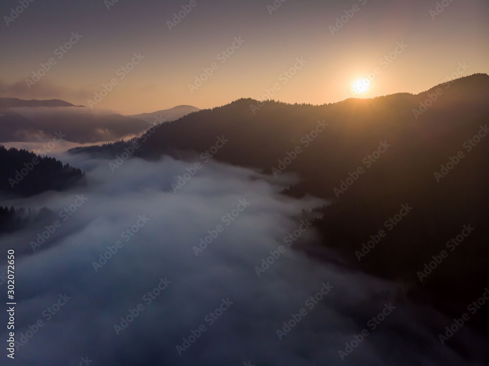 Fototapeta premium silhouettes of mountains and fog at sunrise