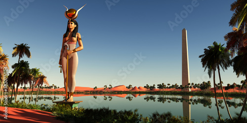 Hathor Statue in Egypt - Hathor was the symbolic Egyptian mother of the pharaohs. Here she stands as a statue near an obelisk by the Nile river. photo