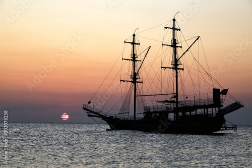 Ship at sea at dawn