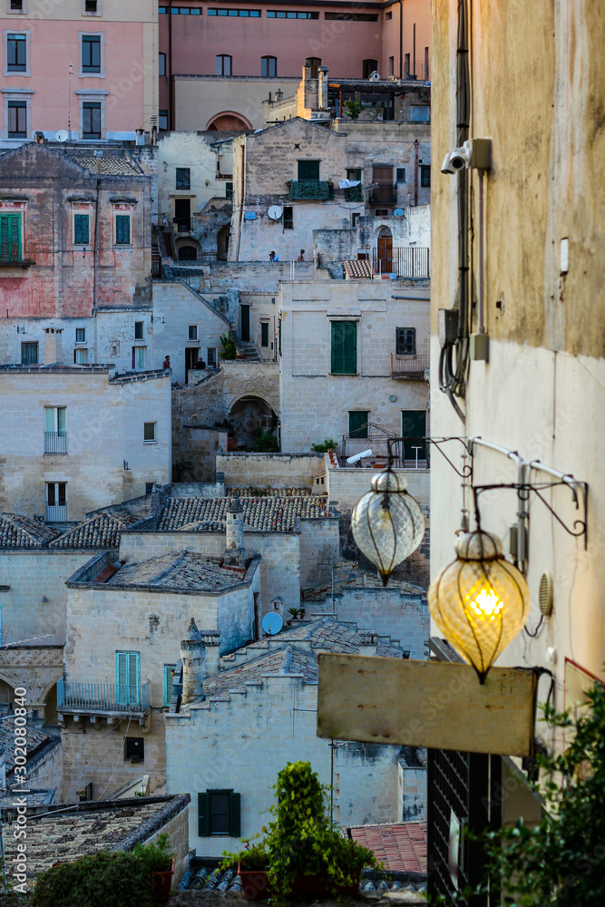 Φωτογραφία restaurant pizzeria signboard at sunset in the city of Matera, Basilicata, Italy
