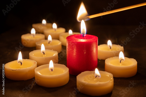 A match lights the fire of many candles