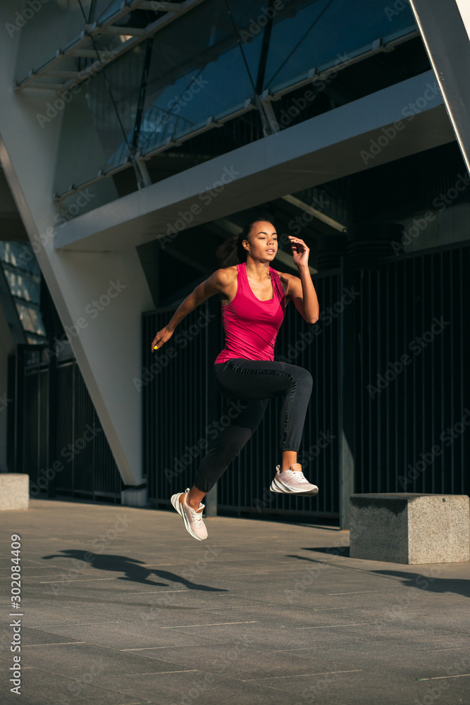 Beautiful sporty woman in motion stock photo