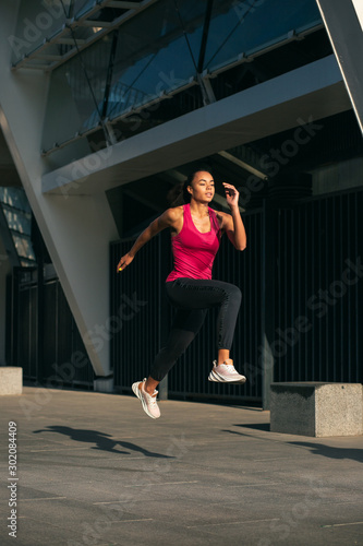 Beautiful sporty woman in motion stock photo