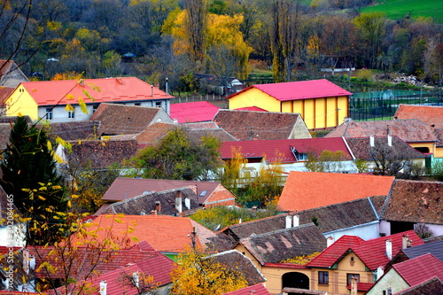 Typical rural landscape and peasant houses in Garbova, Transylvania, Romania. The settlement was founded by the Saxon colonists in the middle of the 12th century photo