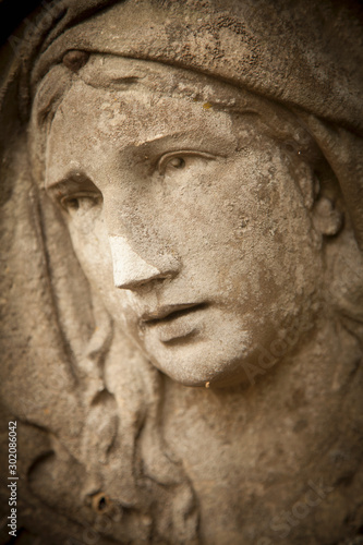 The look of love and eyes of Virgin Mary. Fragment of beautiful ancient statue. Religion, faith, Christianity concept.