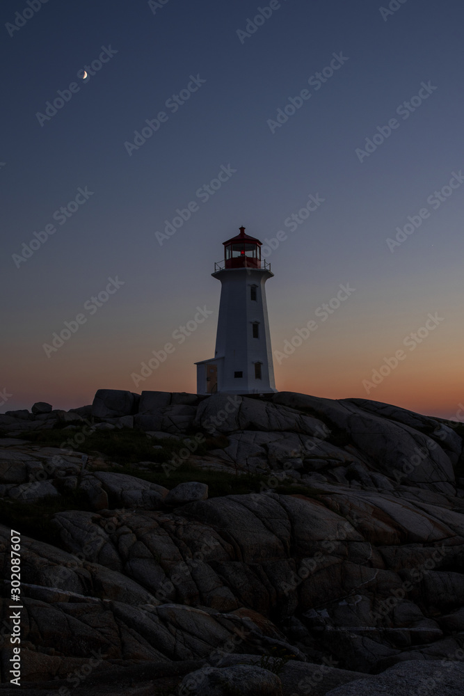 Lighthouse at Peggys Cove at sunset NS Canada