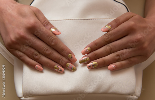 female hands with manicure - volume and crystals