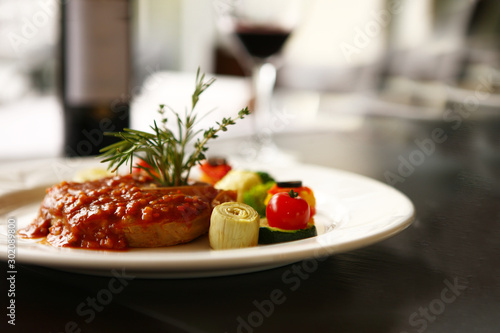 steak with tomtao and pepper mit in background photo