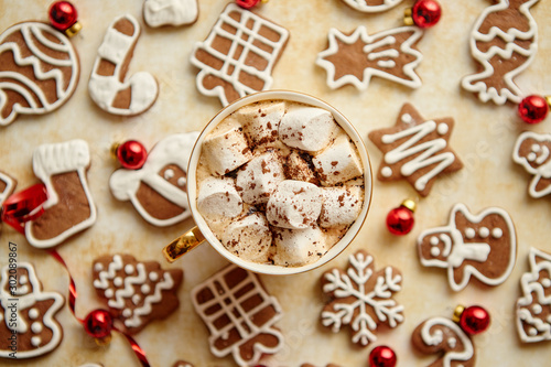 Cup of hot chocolate and Christmas shaped gingerbread cookies
