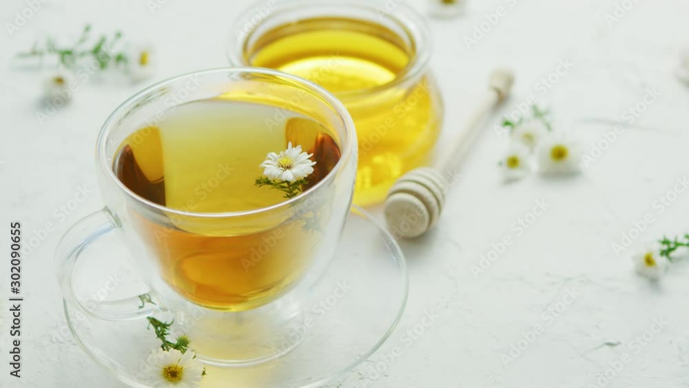 Closeup of cup with camomile tea Closeup of cup with camomile tea