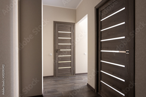 Corridor in a small apartment, closed doors photo