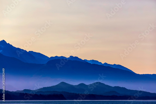 Silhouetted Mountains and Ocean at Sunset