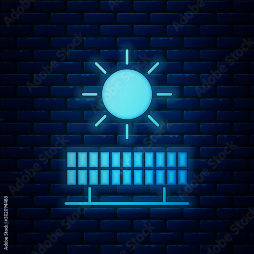 Glowing neon Solar energy panel and sun icon isolated on brick wall background. Vector Illustration