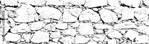 Distressed overlay texture of rough surface, cracked rocks, stone wall. Grunge background. one color graphic resource.