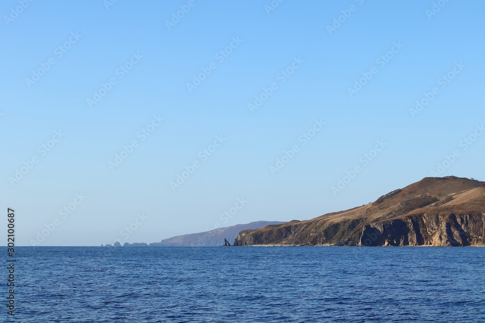 Seascape of the Sea of Japan, Putyatin and Ascold Islands in sunny autumn day.