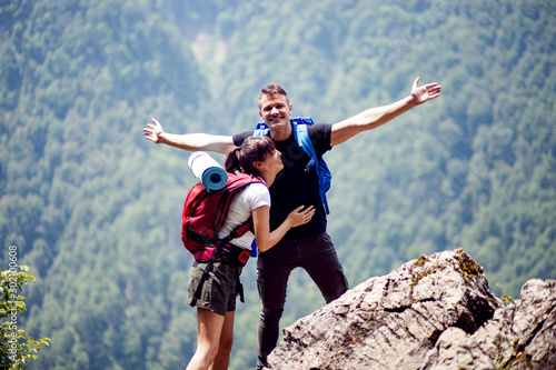 Hiking couple enjoying together in nature environment
