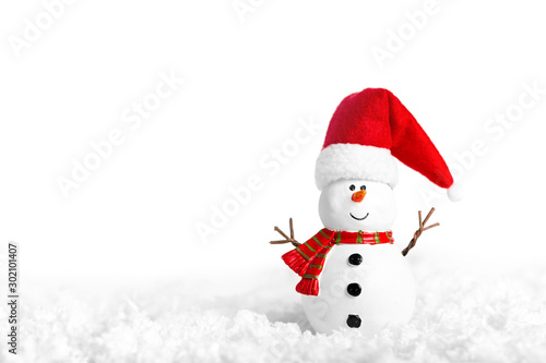 Fototapeta Toy of snowman on snow over white background
