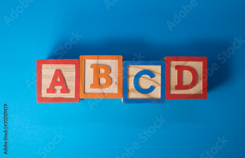 A, B, C and D wooden blocks