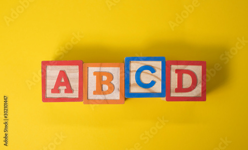 A, B, C and D wooden blocks