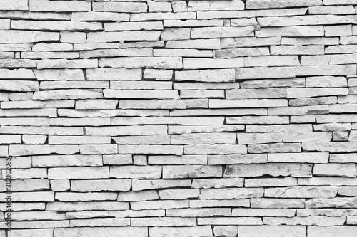 Pattern on the white stone wall texture background