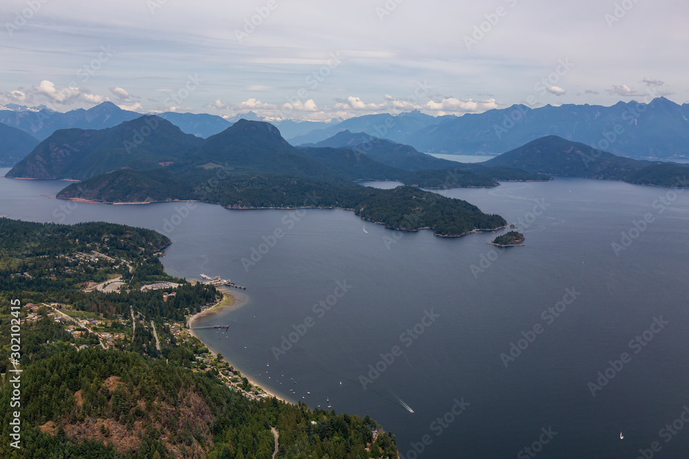 Gibsons, Sunshine Coast, British Columbia, Canada. Aerial View of a small town in Howe Sound during a cloudy summer evening.